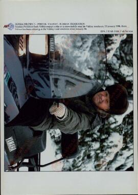 EPA/ITAR-TASS: "Russian President Boris Yeltsin enjoys a ride on a snowmobile near his Valday residence, 13 January 1998. Boris Yeltsin has been relaxing at the Valday rural residence since January 4". Valday, January 14th., 1998.